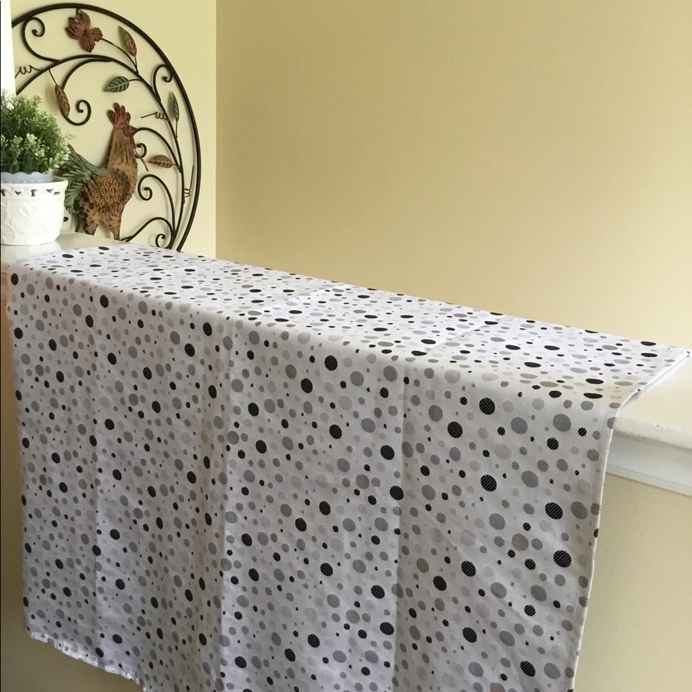 Grey polka dot shower curtain.